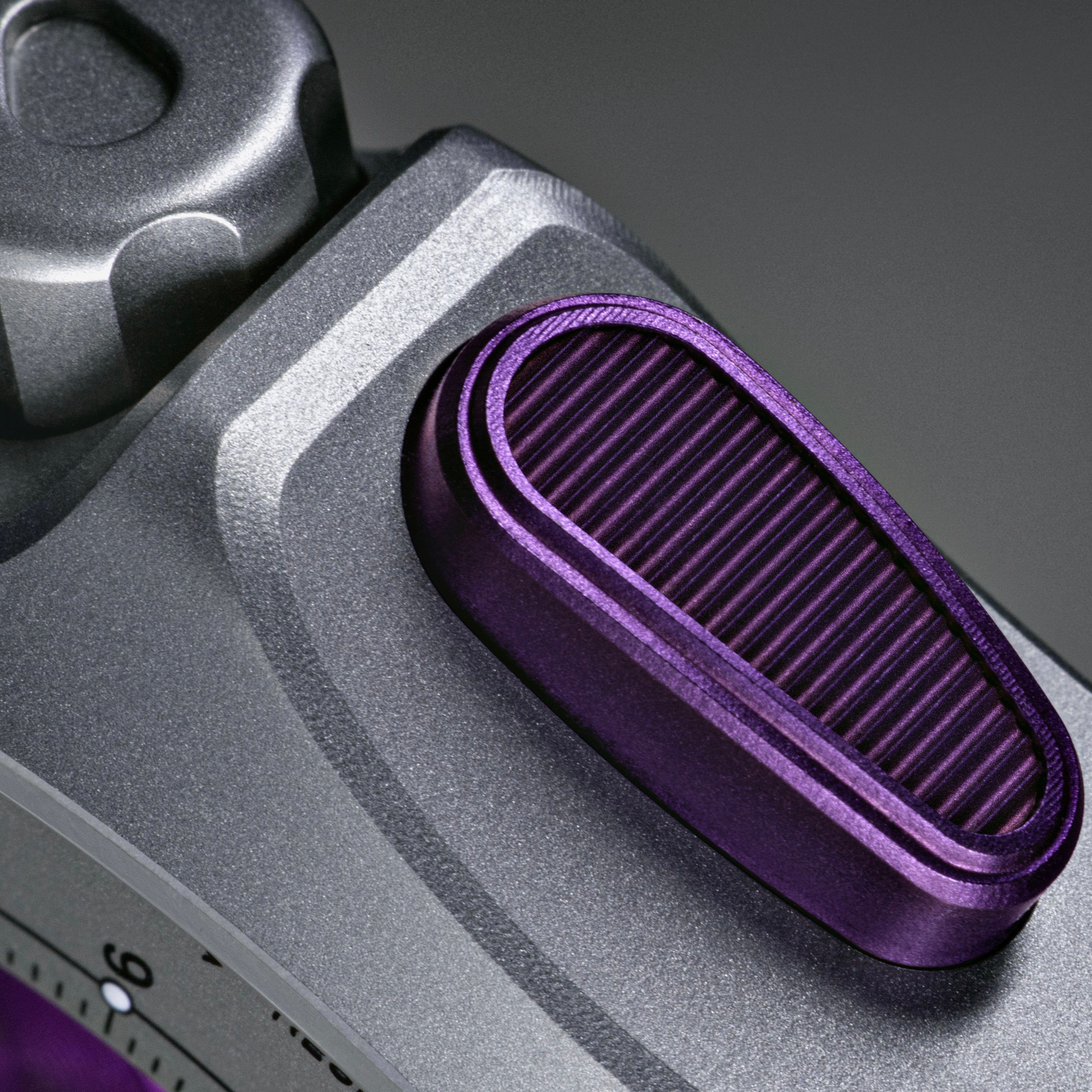 Isotope Moonshot Chronograph Thunderclap Close-up of a purple push button