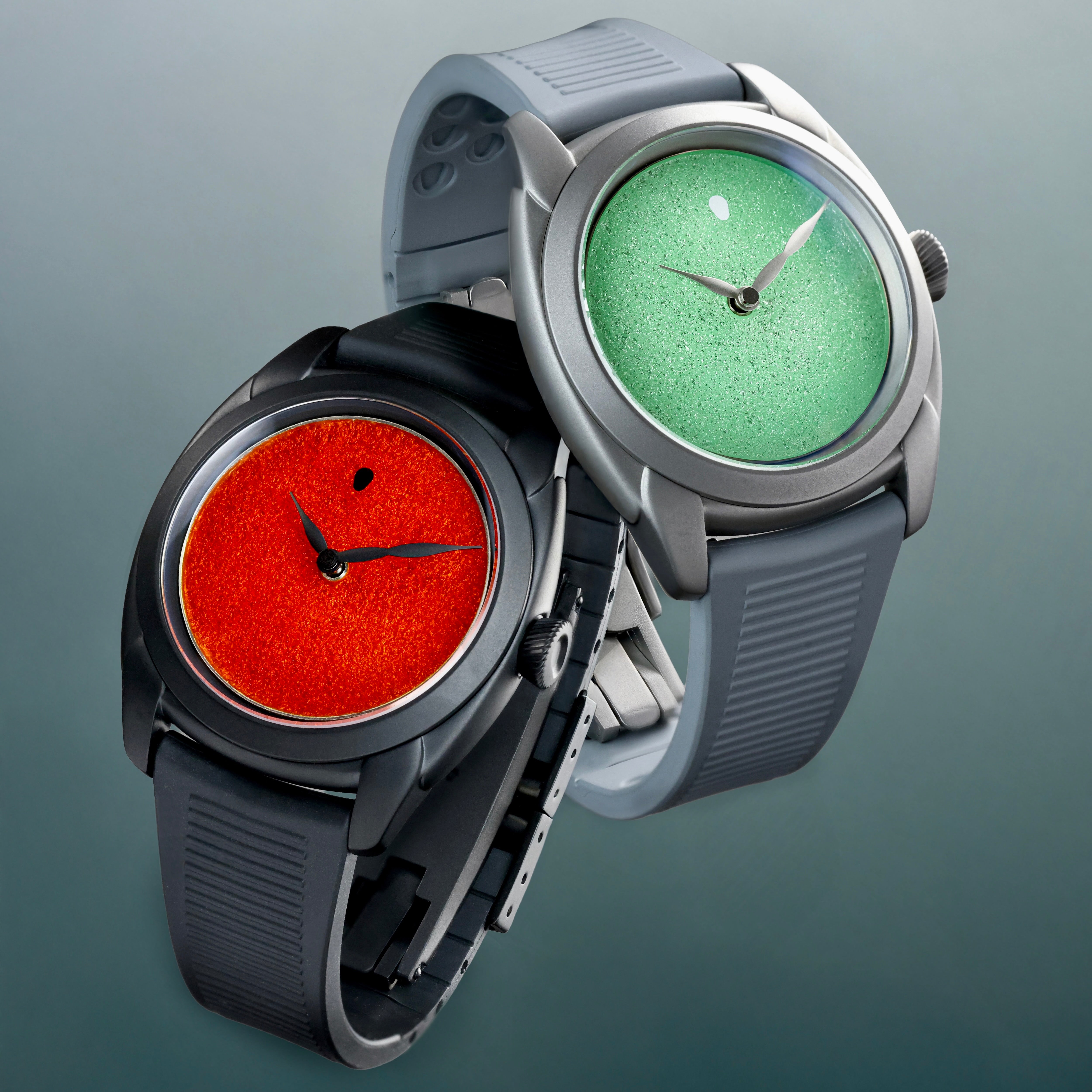 Two watches with different colored faces on a gray background, featuring 'Oracle Time' and 'Isotope' branding.