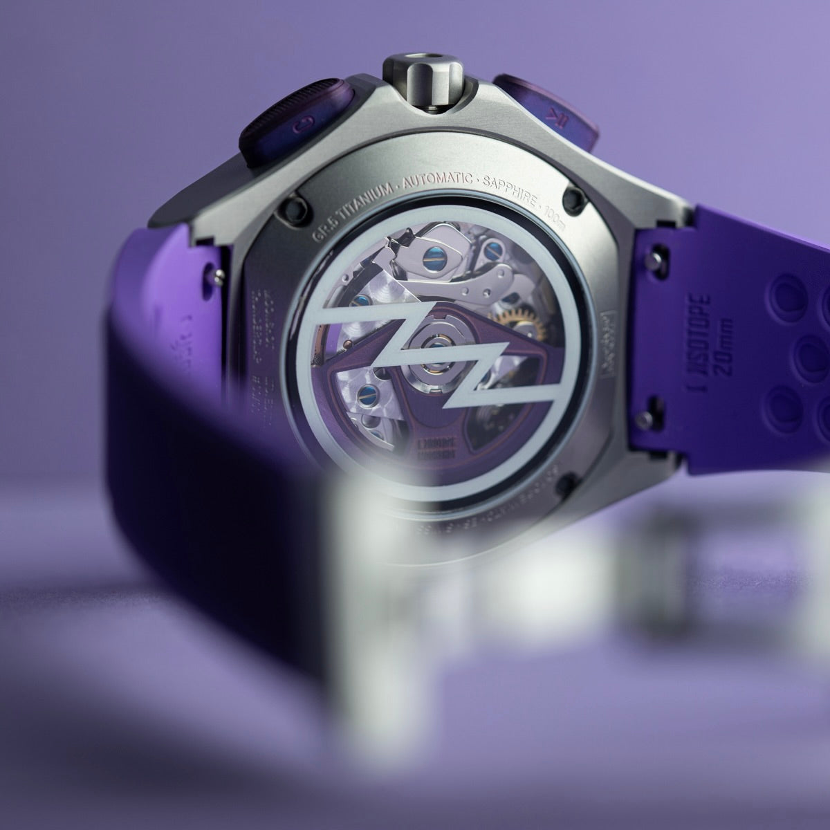 Isotope Moonshot Chronograph Thunderclap caseback Close-up on a purple strap