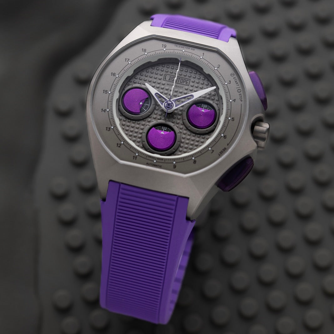 Isotope Moonshot Chronograph Thunderclap with purple and silver design on a textured black background