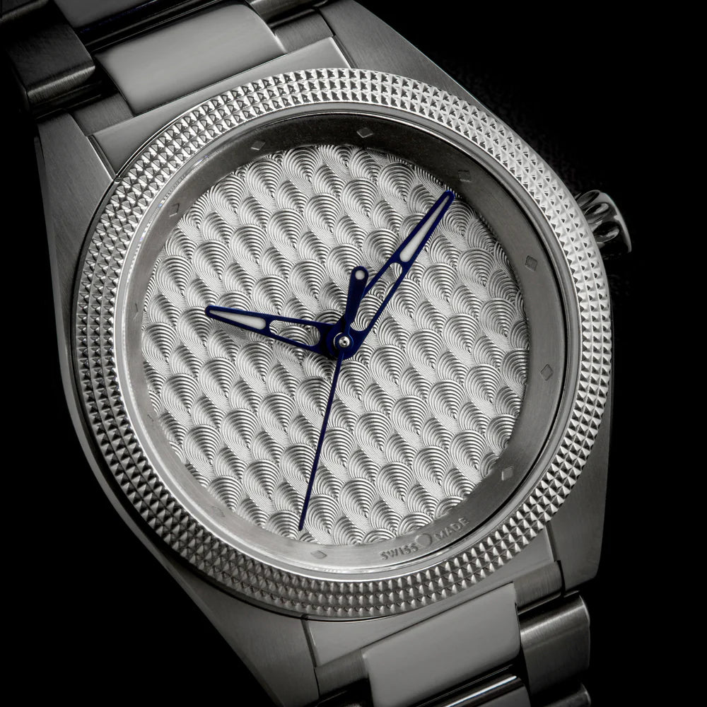 Isotope watch with a guilloché wave-pattern dial and blue teardrop Lacrima hands