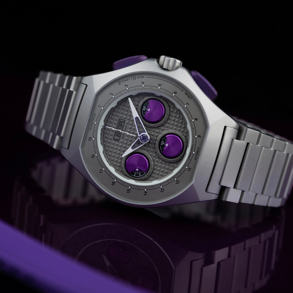 Isotope Moonshot Chronograph Thunderclap with purple accents on a reflective surface