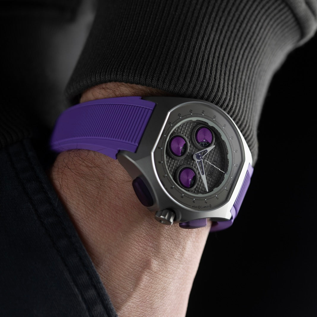 Isotope Moonshot Chronograph Thunderclap with purple band on a wrist against a dark background